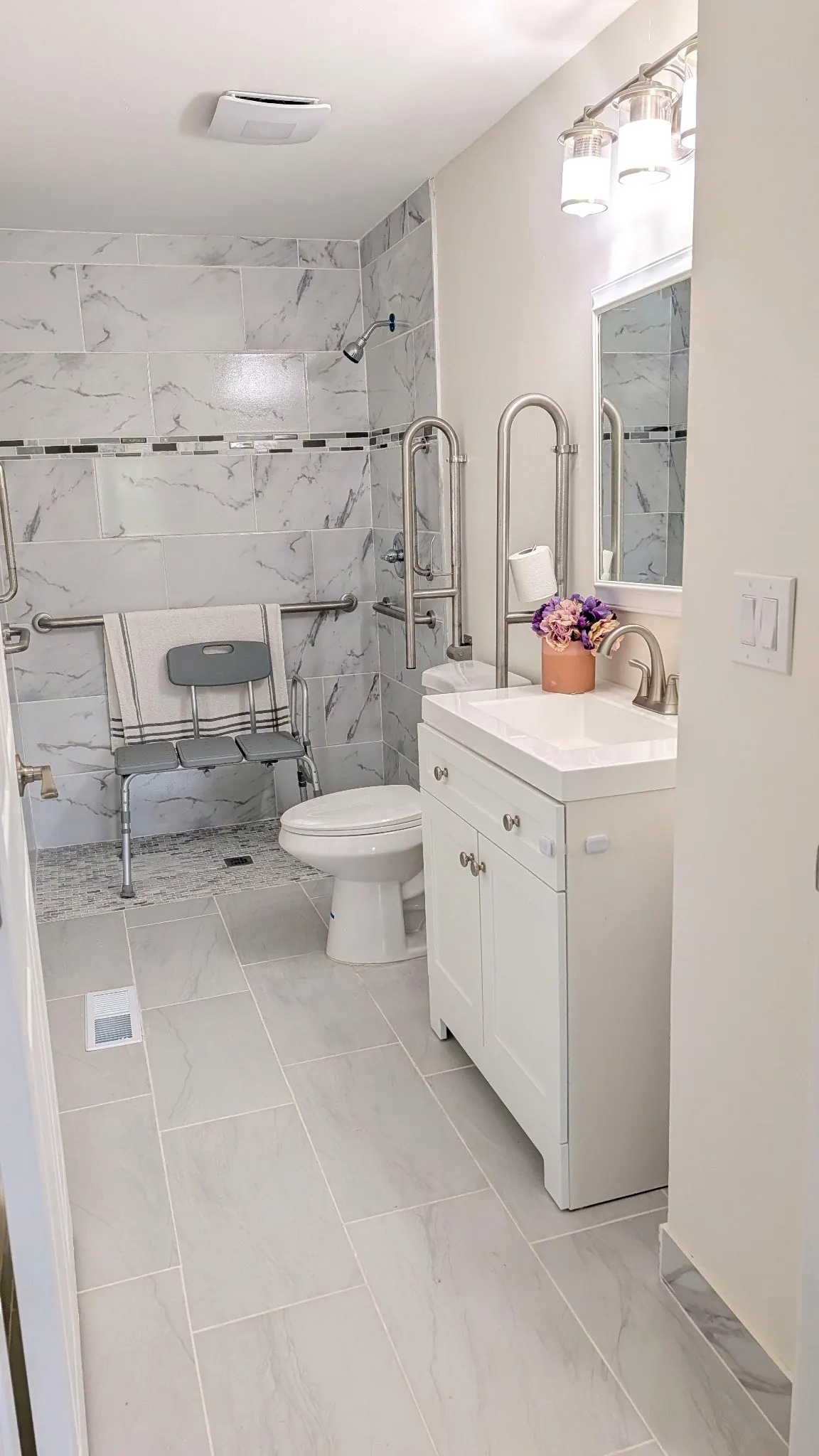 Accessible bathroom with safety rails at Rest Assured AFH