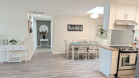 Open dining and kitchen area inside Rest Assured AFH in Everett, Washington